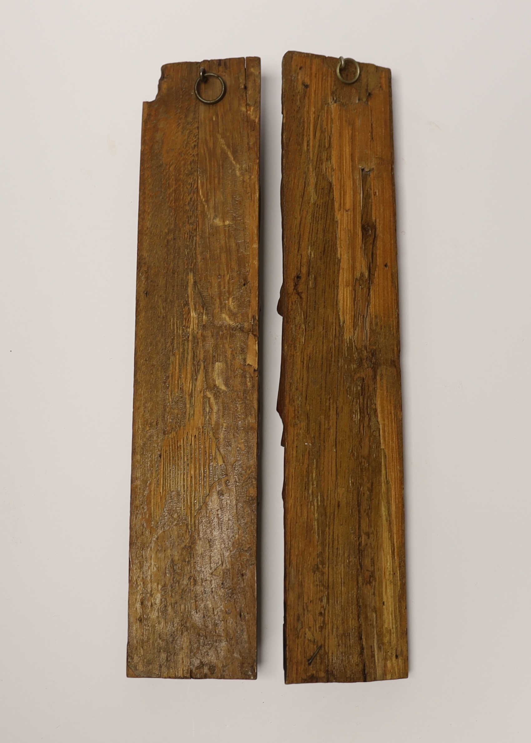 A pair of 17th century carved wood terminal figures, 39cm high